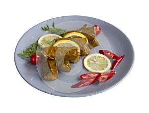 Grape leaves with olive oil isolated on a white background.. Turkish cuisine appetizers